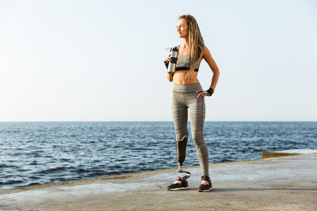 woman taking a break from jogging